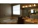 Bathroom featuring a soaking tub, double vanity, and neutral decor at 13016 Islamorada Dr, Orlando, FL 32837