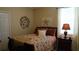 Bedroom boasting neutral colored walls, matching bedside tables, and window at 13016 Islamorada Dr, Orlando, FL 32837