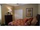 Comfortable bedroom featuring closet, dresser, and tropical themed decor at 13016 Islamorada Dr, Orlando, FL 32837