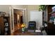 Elegant home office with French doors, hardwood floors, and a view into the home at 13016 Islamorada Dr, Orlando, FL 32837