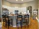 Bright eat-in kitchen features granite countertops, stainless steel appliances, and breakfast bar with seating at 13016 Islamorada Dr, Orlando, FL 32837