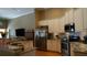 Modern kitchen boasts stainless steel appliances, granite countertops, and ample cabinet space at 13016 Islamorada Dr, Orlando, FL 32837