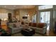 Spacious living area with comfortable seating, hardwood floors, and backyard access at 13016 Islamorada Dr, Orlando, FL 32837