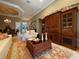 Comfortable living space with neutral walls, a large cabinet, and elegant furnishings at 13016 Islamorada Dr, Orlando, FL 32837