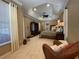 Spacious main bedroom with sitting area, tray ceilings, and ample natural light at 13016 Islamorada Dr, Orlando, FL 32837