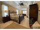 Spacious main bedroom with tray ceiling, offering plenty of room for relaxation and comfort at 13016 Islamorada Dr, Orlando, FL 32837