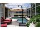 Inviting screened-in pool area with comfortable lounge seating and a relaxing atmosphere at 13016 Islamorada Dr, Orlando, FL 32837