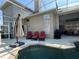 Covered pool with ample seating, including outdoor furniture, offers a relaxing outdoor space for leisure and entertainment at 13016 Islamorada Dr, Orlando, FL 32837