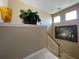 Staircase with off-white carpet, complemented by decor and natural light at 13016 Islamorada Dr, Orlando, FL 32837