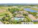 Stunning aerial view of the community, highlighting the pool, landscaping, and surrounding golf course at 1308 Shinnecock Hills Dr, Davenport, FL 33896
