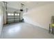 Spacious garage with an automatic door, ready for parking and storage at 1308 Shinnecock Hills Dr, Davenport, FL 33896