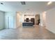 Open living area seamlessly connecting the kitchen, dining, and living spaces with tile flooring at 1308 Shinnecock Hills Dr, Davenport, FL 33896