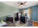 Bedroom with ceiling fan, mixed walls, area rug, and large window at 16 Sawfish Ct, Kissimmee, FL 34759