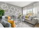 Comfortable living room featuring stylish decor, modern accents, and ample natural light at 16 Sawfish Ct, Kissimmee, FL 34759
