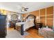 This main bedroom features decorative moulding, hardwood floors, and nice furniture at 16 Sawfish Ct, Kissimmee, FL 34759