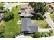 Birds eye view of the property showing the lush green lawn, and surrounding houses in a quiet neighborhood at 17 S Flag Ct, Kissimmee, FL 34759