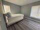Cozy bedroom with neutral walls, light-colored wood floors, and plenty of natural light at 17 S Flag Ct, Kissimmee, FL 34759