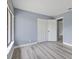 A bedroom with wood-look floors features a closet with folding doors at 17 S Flag Ct, Kissimmee, FL 34759