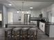 Bright and airy kitchen with a large island, stainless steel appliances, and stylish barstool seating at 17 S Flag Ct, Kissimmee, FL 34759
