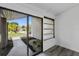 Bright patio space with sliding glass doors and a view of the front yard at 17 S Flag Ct, Kissimmee, FL 34759