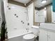 Cozy bathroom features a tub, shower, toilet, and vanity, perfect for relaxation at 171 Stanley Bell Dr, Mount Dora, FL 32757