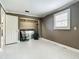 Bedroom with tile floors, shuttered window, closet, and space for use as a home office at 171 Stanley Bell Dr, Mount Dora, FL 32757