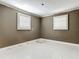 Neutral bedroom showcasing tile floors and shuttered windows, ready for personalization at 171 Stanley Bell Dr, Mount Dora, FL 32757