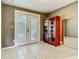 Versatile flex room with tile floors, storage cabinet, and French doors to outdoor space at 171 Stanley Bell Dr, Mount Dora, FL 32757