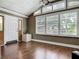 Foyer featuring hardwood floors, plantation shutters, vaulted ceilings, with a view to a front door and a front yard at 171 Stanley Bell Dr, Mount Dora, FL 32757