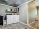 Cozy laundry room features a washer and dryer, plus built-in shelves for storage at 171 Stanley Bell Dr, Mount Dora, FL 32757