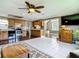 View of the living room leading into kitchen featuring stainless steel appliances, and ample cabinet space at 171 Stanley Bell Dr, Mount Dora, FL 32757
