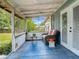 Relaxing screened porch with seating and a view of the backyard at 171 Stanley Bell Dr, Mount Dora, FL 32757