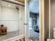 Bathroom boasts an updated shower with white subway tile, rain shower head, and a built-in bench at 171 Stanley Bell Dr, Mount Dora, FL 32757