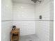 Modern bathroom showcasing a white subway tile shower with penny tile floor and seating at 171 Stanley Bell Dr, Mount Dora, FL 32757