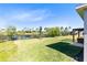 Expansive backyard with lush green grass, a scenic view, and a charming patio, perfect for outdoor enjoyment at 17335 Million Lakes Ct, Clermont, FL 34714