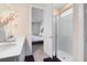 Bright bathroom with a glass door shower, a single sink vanity, and modern finishes at 17335 Million Lakes Ct, Clermont, FL 34714
