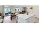 Bright open concept kitchen with large island, stainless appliances, and adjacent dining and living areas at 17335 Million Lakes Ct, Clermont, FL 34714