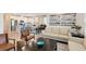 Living space with neutral furniture, open floor plan, and seamless transitions to kitchen and dining at 17335 Million Lakes Ct, Clermont, FL 34714