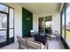 A cozy outdoor space with stylish seating, a green wall, and a tranquil ambiance for relaxation and entertainment at 17335 Million Lakes Ct, Clermont, FL 34714