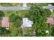 Aerial shot of a neighborhood with tree-lined streets and well-maintained homes at 1881 Cottonwood St, Orange City, FL 32763