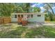 Inviting home with a cozy front porch, well-maintained lawn, and a charming curb appeal at 1881 Cottonwood St, Orange City, FL 32763