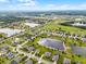 Aerial view of the community, highlighting the lake, ponds, and neighborhood layout at 2260 Grayling St, Orlando, FL 32820