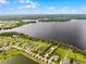 An aerial view capturing the lake and the community surrounding the residence at 2260 Grayling St, Orlando, FL 32820
