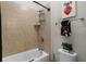 This bathroom features a tub, tiled walls, and charming decor at 2260 Grayling St, Orlando, FL 32820