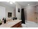 Bathroom featuring single sink, granite countertops, and a shower-tub combo at 2260 Grayling St, Orlando, FL 32820