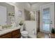 Bathroom features a shower, granite countertop, and convenient access to the patio at 2260 Grayling St, Orlando, FL 32820