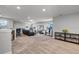 Spacious bonus room with wet bar, TV, exercise equipment, and ample seating, creating a perfect recreation space at 2260 Grayling St, Orlando, FL 32820