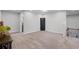Open bonus room with a neutral color scheme, adjacent to a bathroom and staircase, providing versatile space at 2260 Grayling St, Orlando, FL 32820