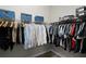 Organized walk-in closet with ample hanging space and storage shelves at 2260 Grayling St, Orlando, FL 32820