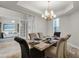 Dining room featuring an elegant chandelier with a view to the living area at 2260 Grayling St, Orlando, FL 32820